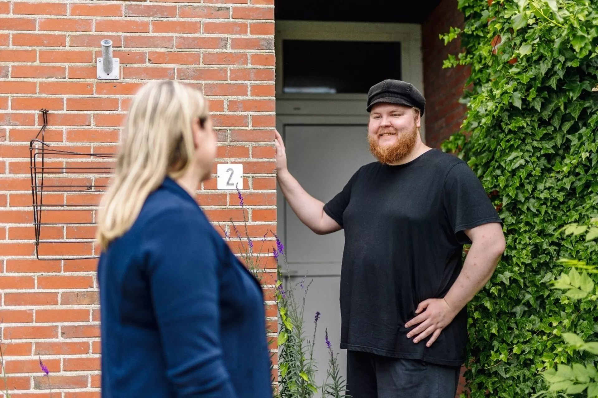 Begroeting bij de deur