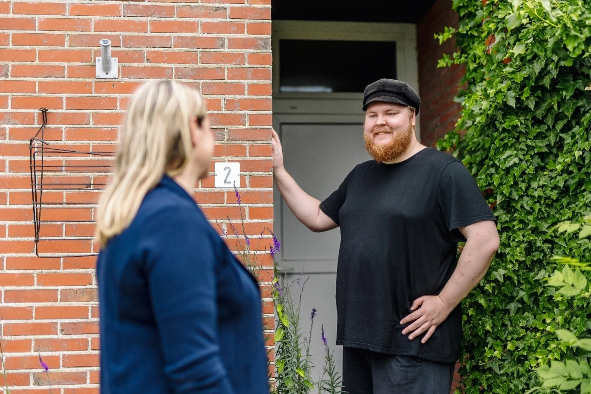 Begroeting bij de deur