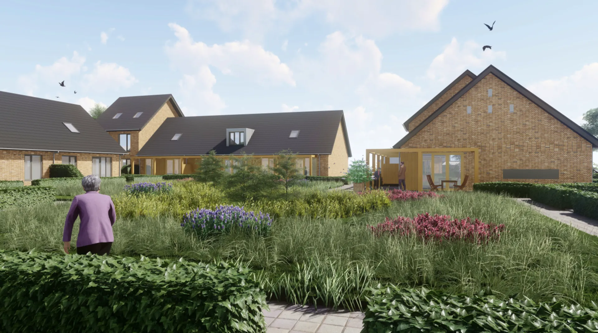 Woningen met tuinen en veel groen onder een blauwe hemel.